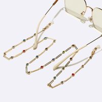 Gold-colored metal non-slip chain, with olval and colorful rhinestones, for glasses and masks GL1629