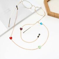 Gold-colored metal non-slip chain, with colored glass beads in the shape of a heart, for glasses and masks GA050