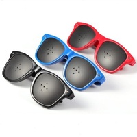 Perforated pinhole glasses with five holes in the lens