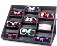 Sunglasses folding holder display with 18 slots, black with a black lining
