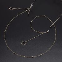 Gold-colored metal non-slip chain, with pendant black pearl and rhinestones, for glasses and masks GL579