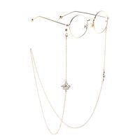 Gold-colored metal non-slip chain, with pendant cross with pearl, for glasses and masks GL823