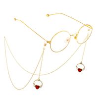 Gold-colored metal non-slip chain, with pendant heart with pearl, for glasses and masks GL570