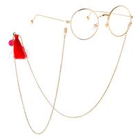 Gold-colored metal non-slip chain, with red tassel and smiley, for glasses and masks GL159