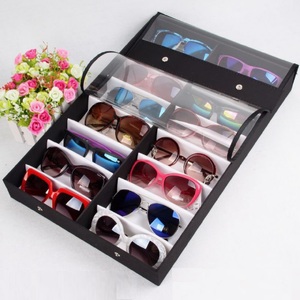 Sunglasses holder display with 16 slots, black with a white lining