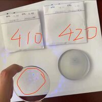 Photochromic gray plastic lenses, index 1.56, with UV410 coating