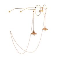 Gold-colored metal non-slip chain, with pendant bee and pearl, for glasses and masks GL930