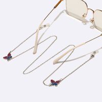 Gold-colored metal non-slip chain, with butterfly, for glasses and masks GL1580