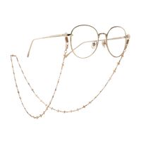 Gold-colored metal non-slip chain, with gold cross, for glasses and masks GA086