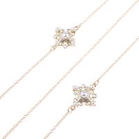 Gold-colored metal non-slip chain, with pendant cross with pearl, for glasses and masks GL823
