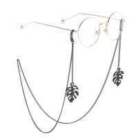 Black-colored metal non-slip chain, with pendant hollow leaves, for glasses and masks GL782