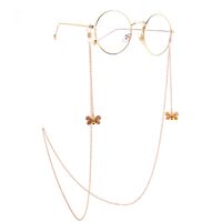 Gold-colored metal non-slip chain, with pendant bee, for glasses and masks GL893