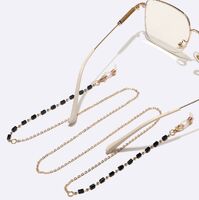 Gold-colored metal non-slip chain, with restangular black crystal, for glasses and masks GL1477
