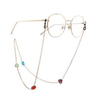 Gold-colored metal non-slip chain, with colored glass beads in the shape of a heart, for glasses and masks GA050