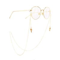 Gold-colored metal non-slip chain, with Christmas bow, for glasses and masks GA036